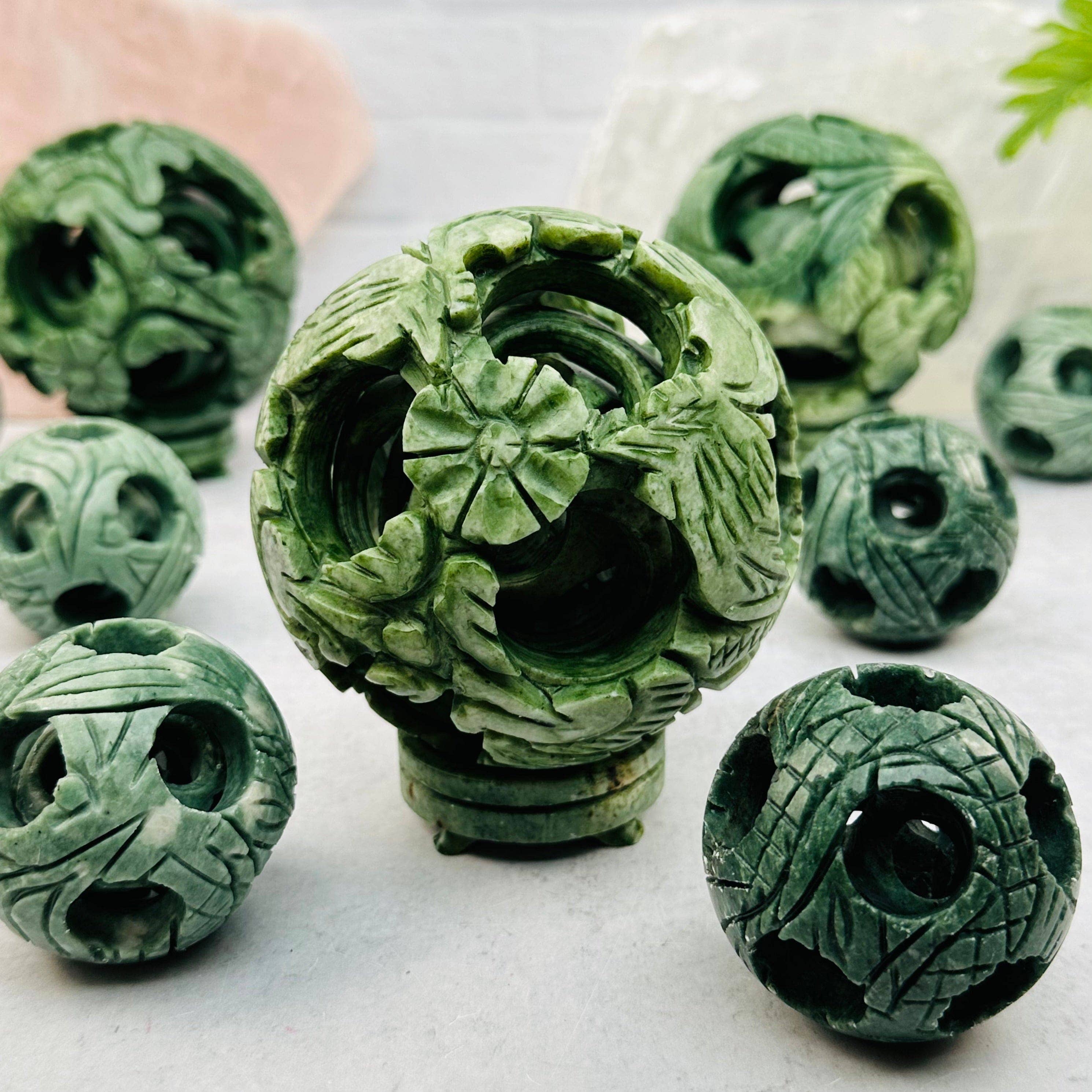 Carved Jade Puzzle Ball – The Cosmic Exchange display picture 1