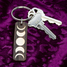 Load image into Gallery viewer, Moon Phases Cut Wooden Keychain
